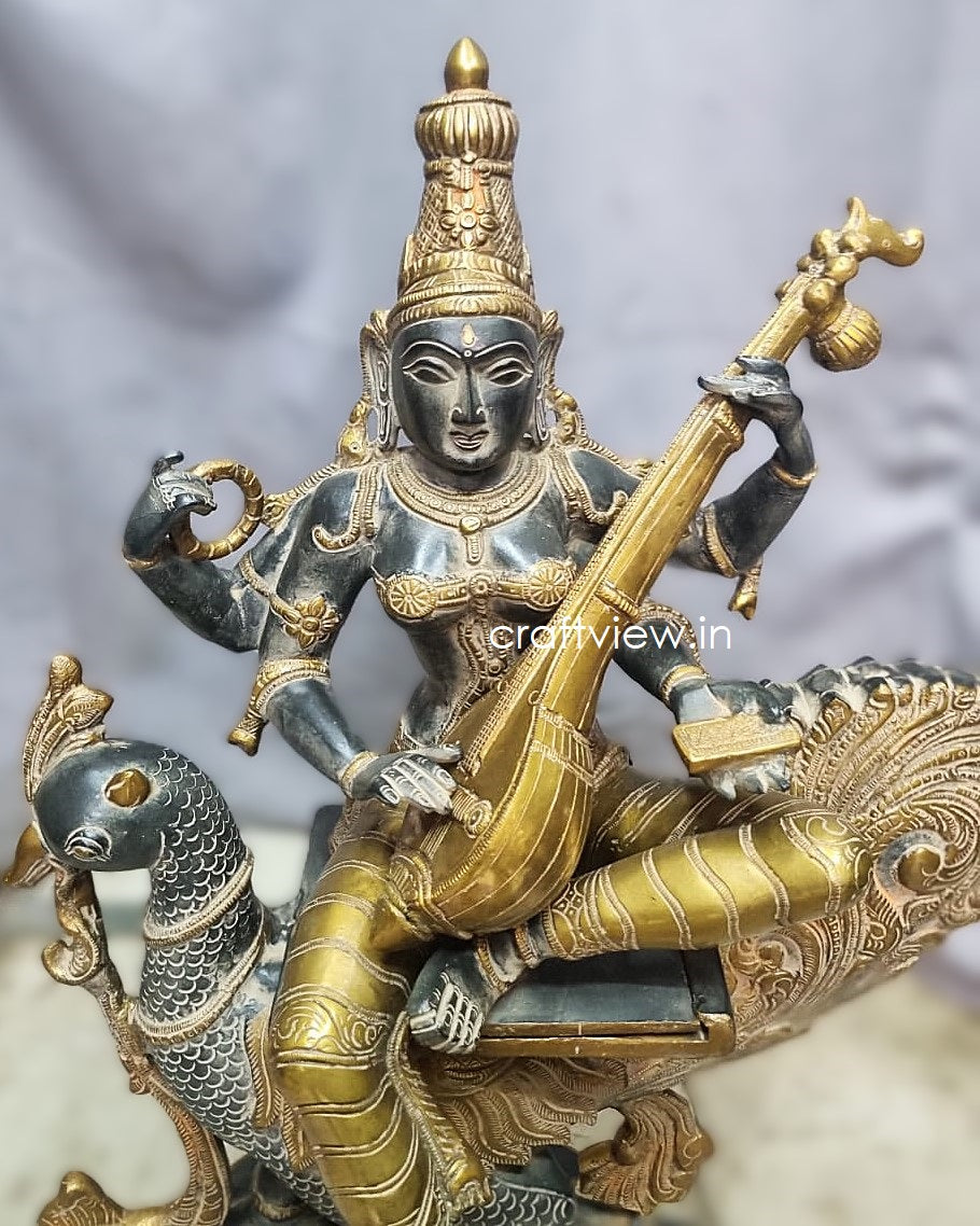 Significance of Sarasvati in Brass Art Sculpture Sitting On Peacock