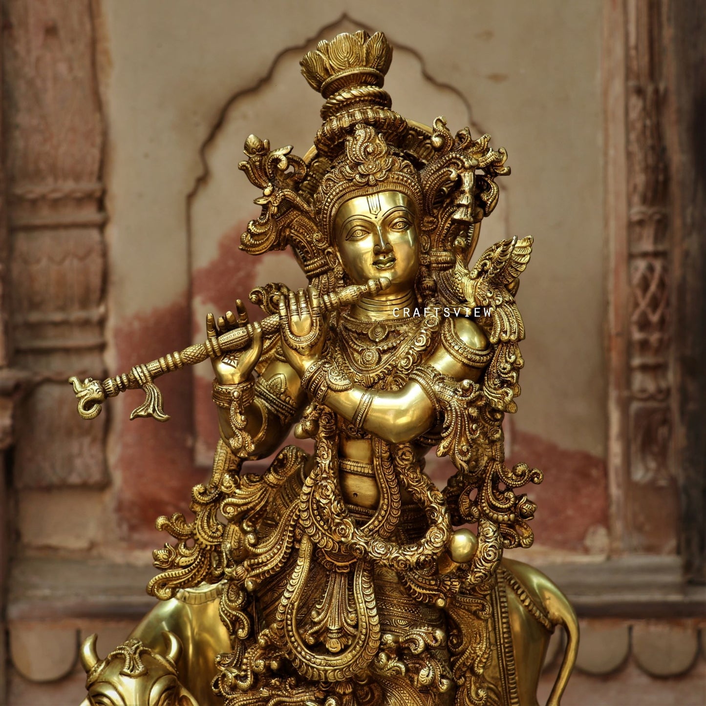 Lord Cow Krishna stands on an engraved base 28"