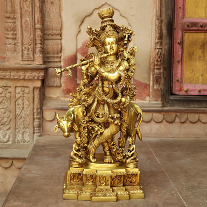 Lord Cow Krishna stands on an engraved base 28"