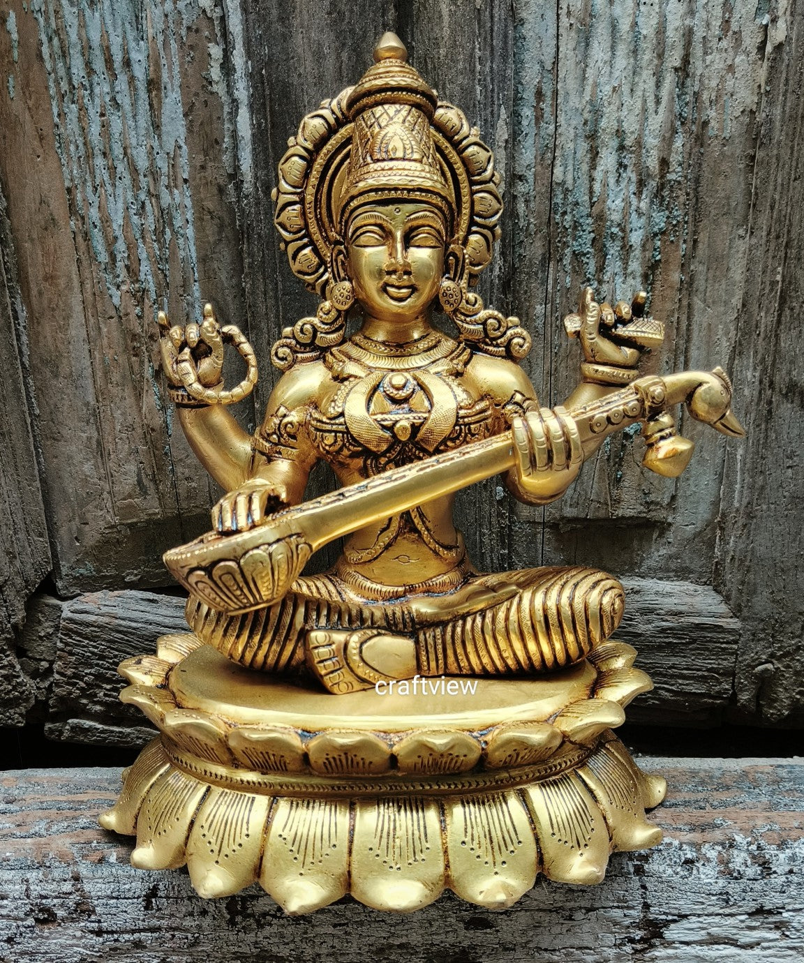 Brass Saraswati Idol sitting on lotus