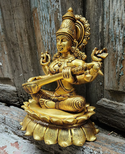 Brass Saraswati Idol sitting on lotus