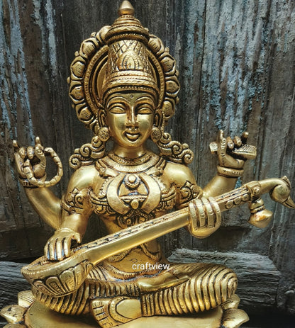 Brass Saraswati Idol sitting on lotus