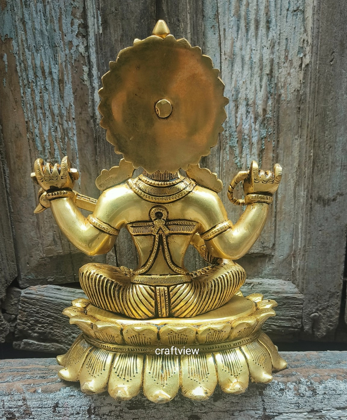 Brass Saraswati Idol sitting on lotus