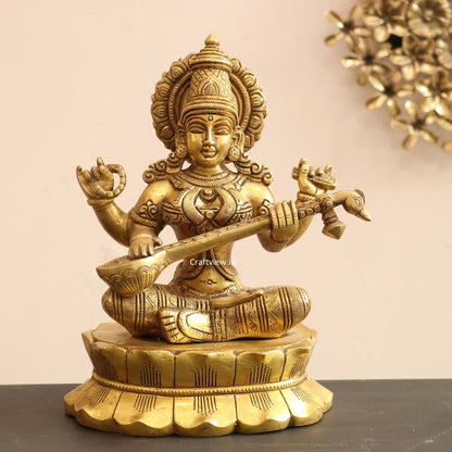 Brass Saraswati Idol sitting on lotus