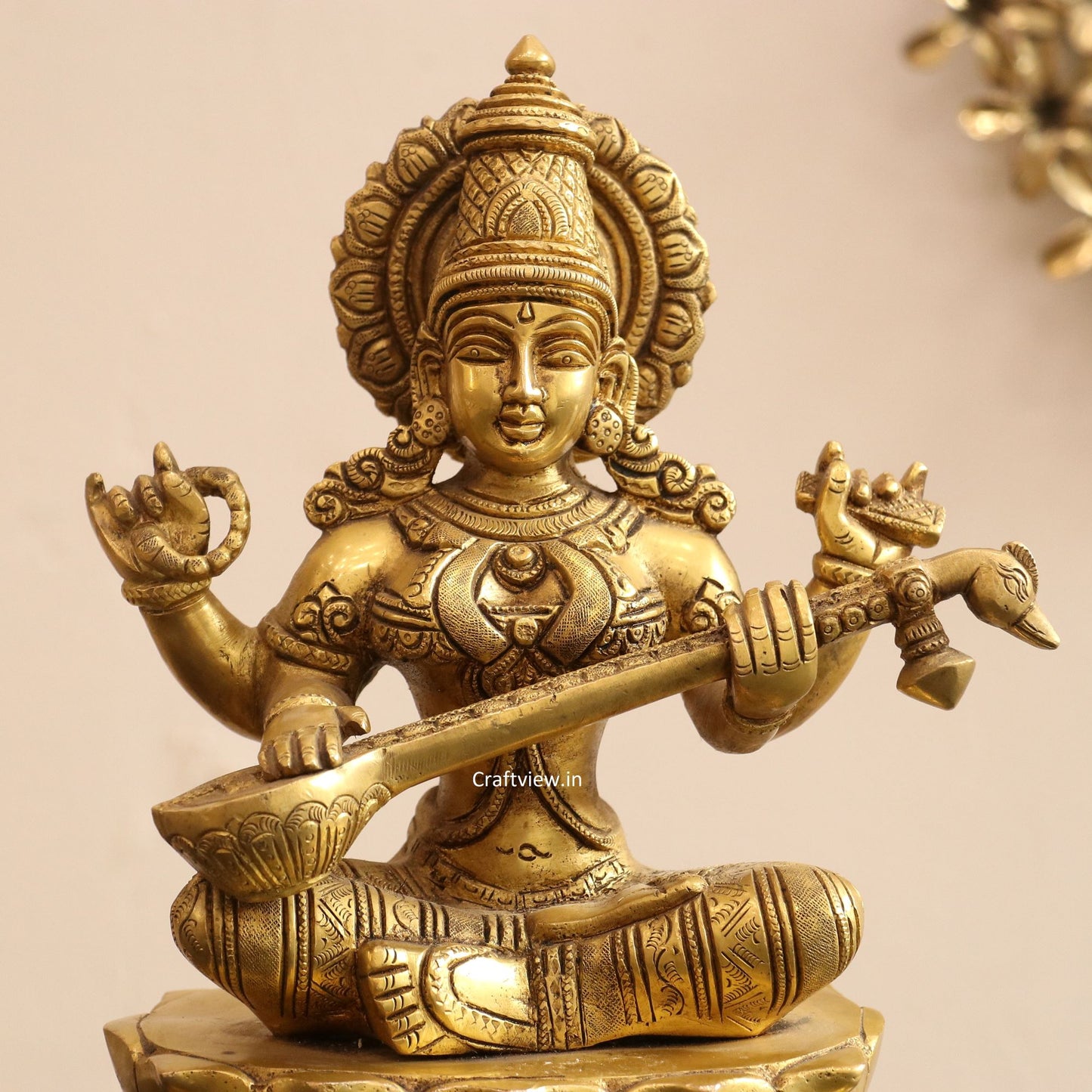 Brass Saraswati Idol sitting on lotus