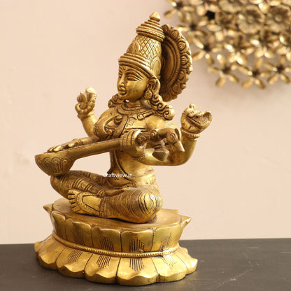 Brass Saraswati Idol sitting on lotus