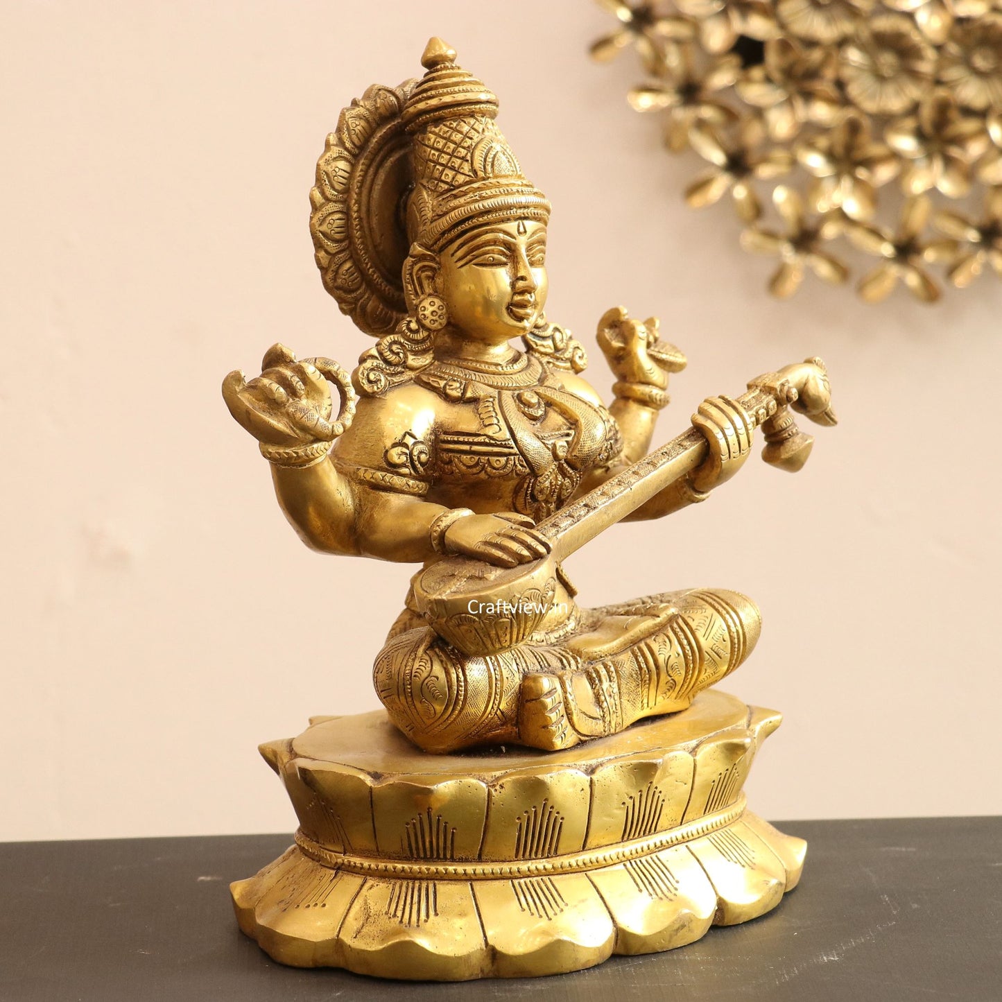 Brass Saraswati Idol sitting on lotus