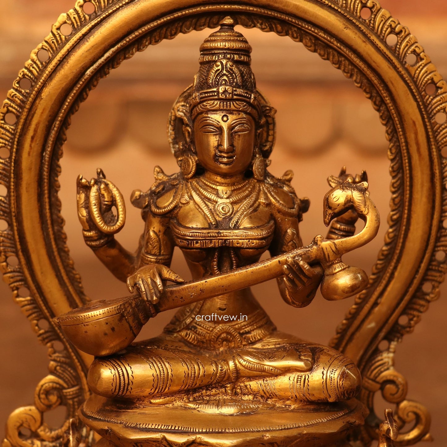 Brass Saraswathi Idol sitting on lotus Base