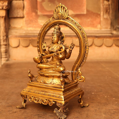 Brass Saraswathi Idol sitting on lotus Base