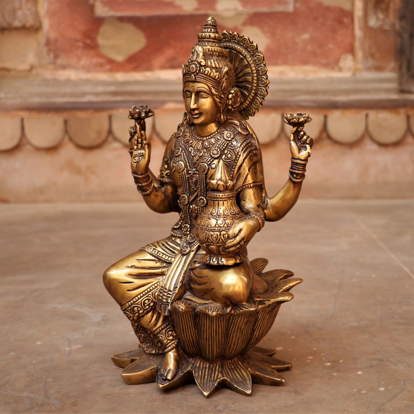 Brass Lakshmi statue sited on Lotus