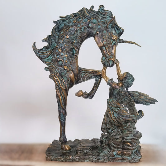 Bronze sculpture of a horse and fairy on a white background